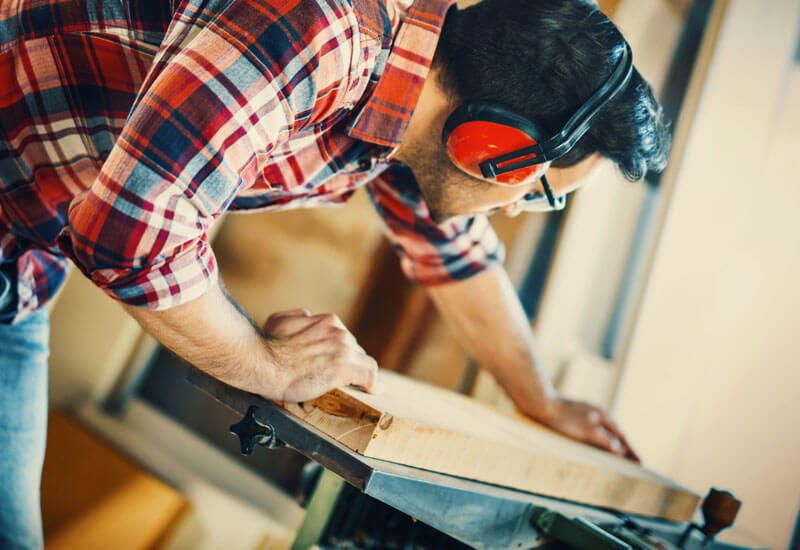 Man cutting wood